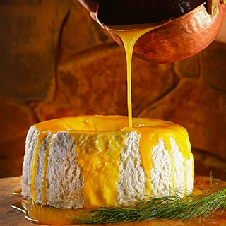 bolo branco com creme laranja saboroso, feito no Clara Resort